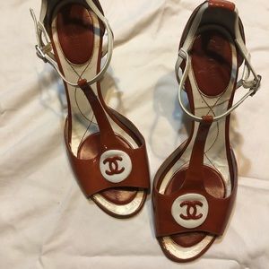 CHANEL burnt orange and white sandals.